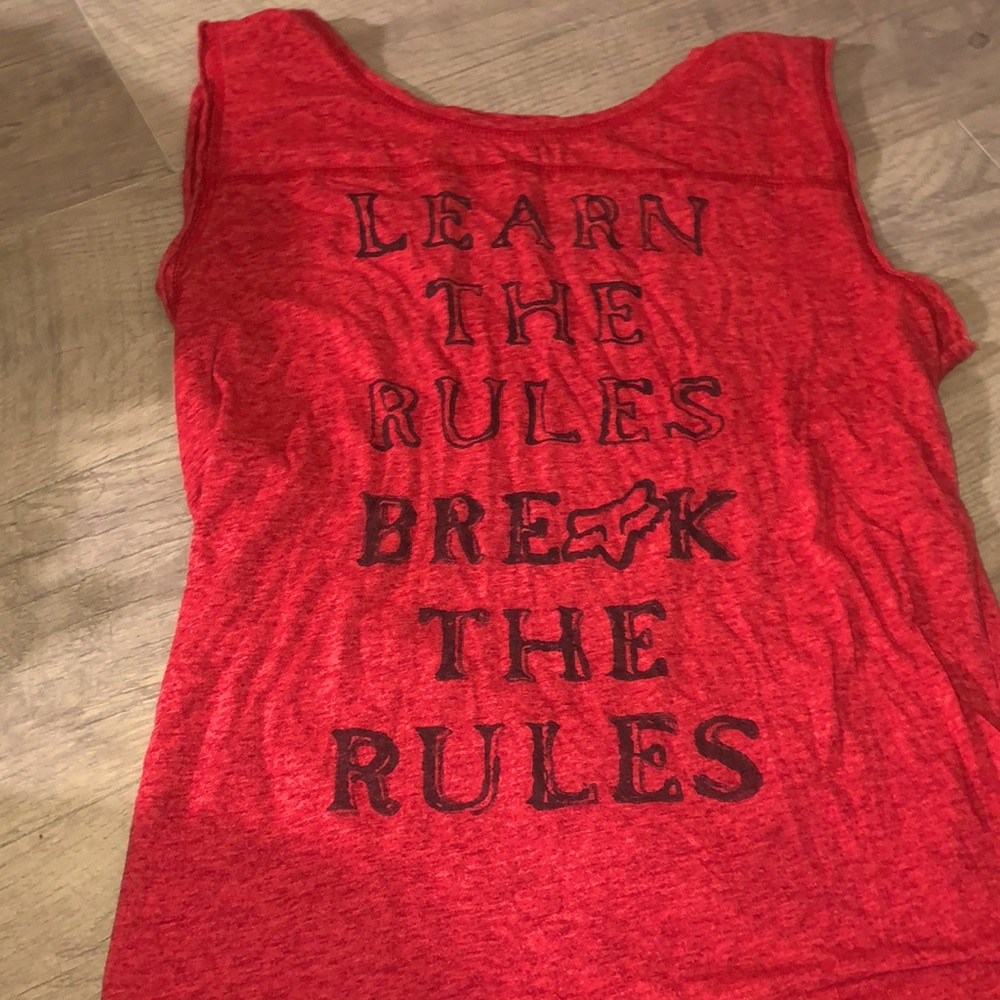 Size large in women worn couple times. Has a opening in the back